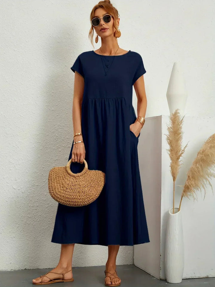 Vestito midi donna con maniche kimono, stile autunnale, casual e sofisticato, perfetto per l'ufficio.