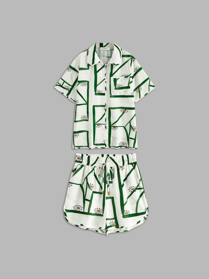Outfit vacanza donna: completo estivo camicia oversize e shorts con fantasie geometriche.