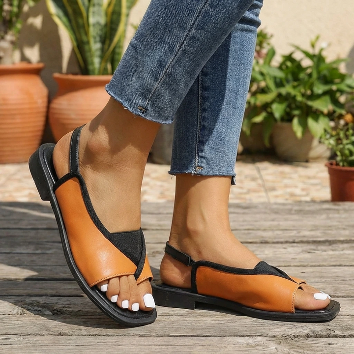 Eleganti sandali aperti da donna, modello slingback, ideali per la moda estiva e comfort quotidiano.