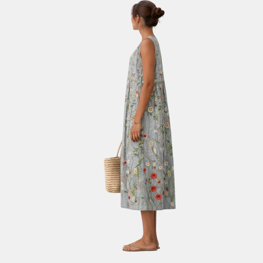 Dettaglio: Stampa botanica delicata su abito midi donna smanicato. Fresco e chic per l'estate.