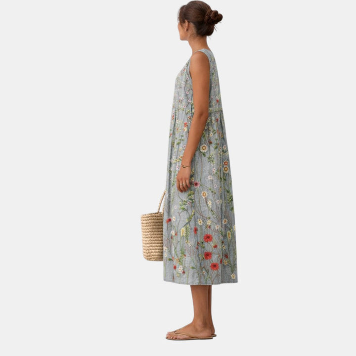 Dettaglio: Stampa botanica delicata su abito midi donna smanicato. Fresco e chic per l'estate.