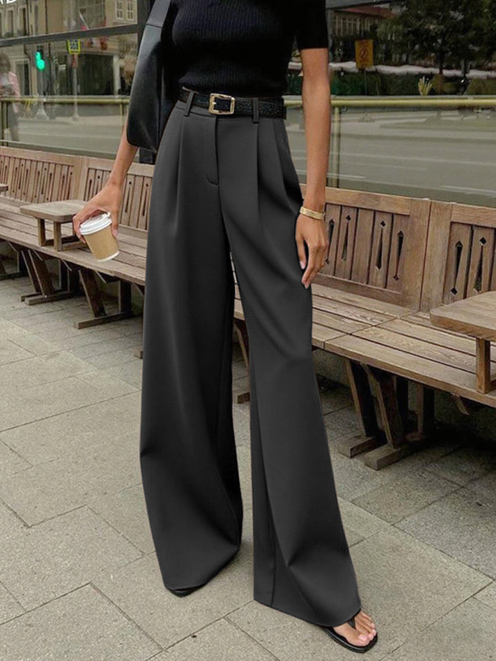 Pantaloni palazzo donna beige, vita alta e gamba larga, stile minimal chic e confortevole.