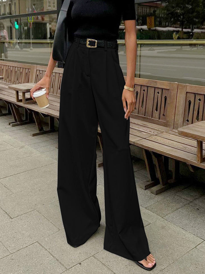 Pantaloni palazzo blu scuro donna, vita alta, gamba larga, look sofisticato.