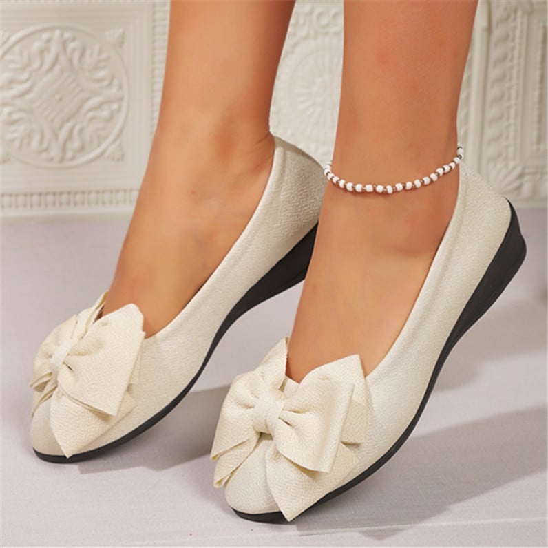 Mocassini donna slip-on neri con fiocco, calzature eleganti e comode per tutte le stagioni.
