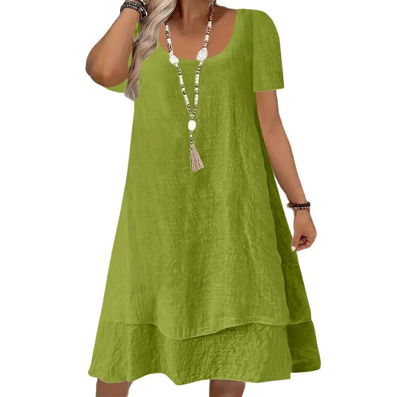 Vestito comodo donna a maniche corte, collo rotondo e vestibilità ampia, ideale per il look quotidiano.