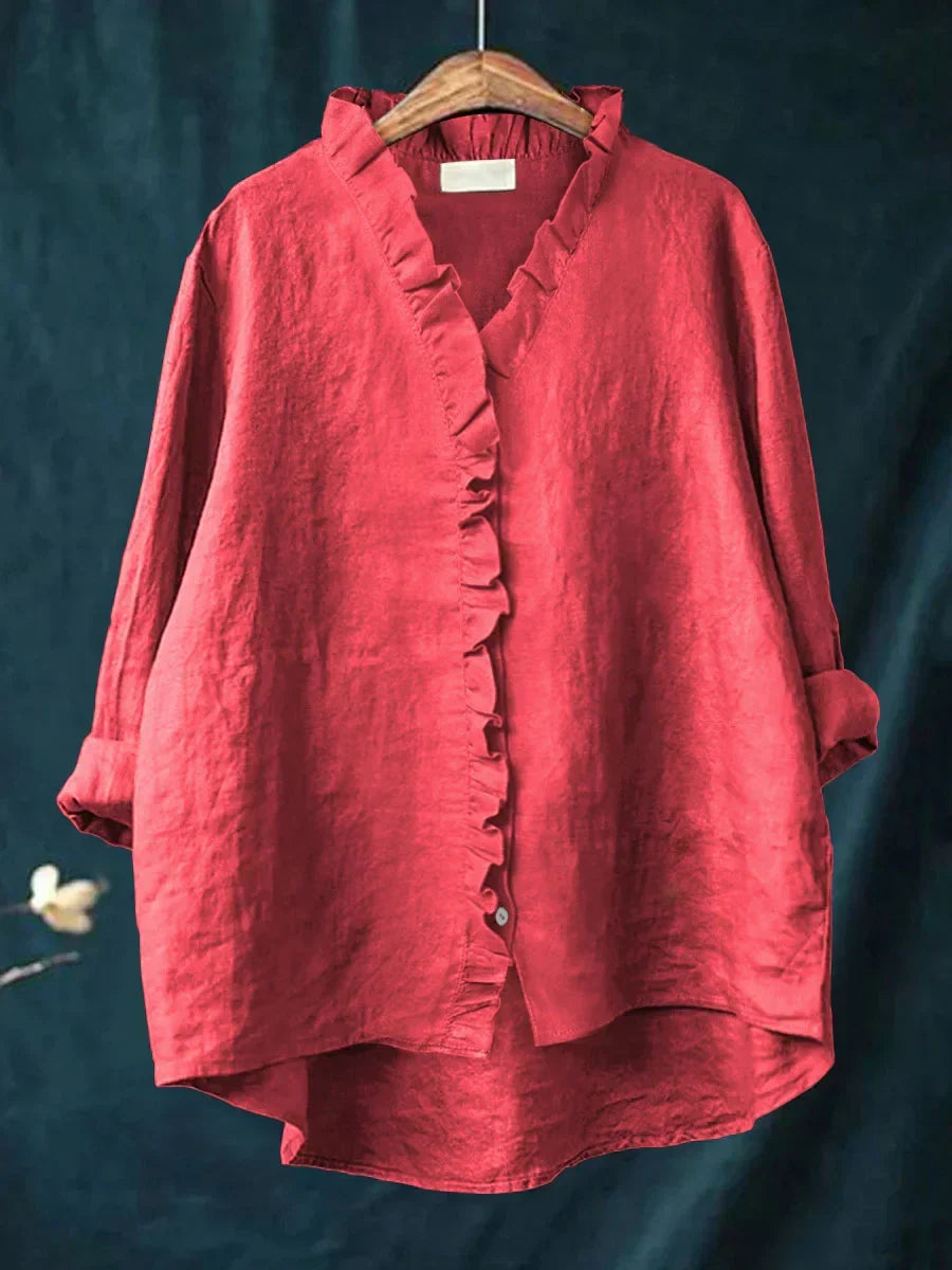 Camicia lino donna elegante con volant e bottoni, perfetta per un look estivo casual o raffinato.