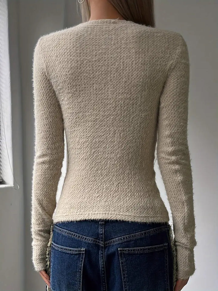 Maglione rosa donna minimalista girocollo, ideale per un abbigliamento femminile comodo e alla moda.