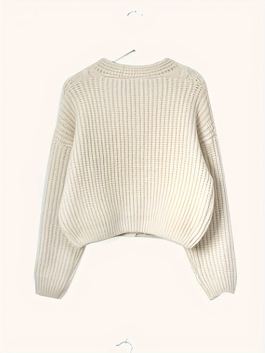 Cardigan donna casual color beige con bottoni, perfetto per outfit autunnali comodi ed eleganti.