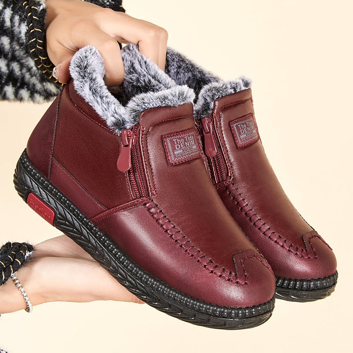 Stivaletti donna con zip laterale e suola comoda. Stivali caldi alla caviglia ideali per calzature invernali.