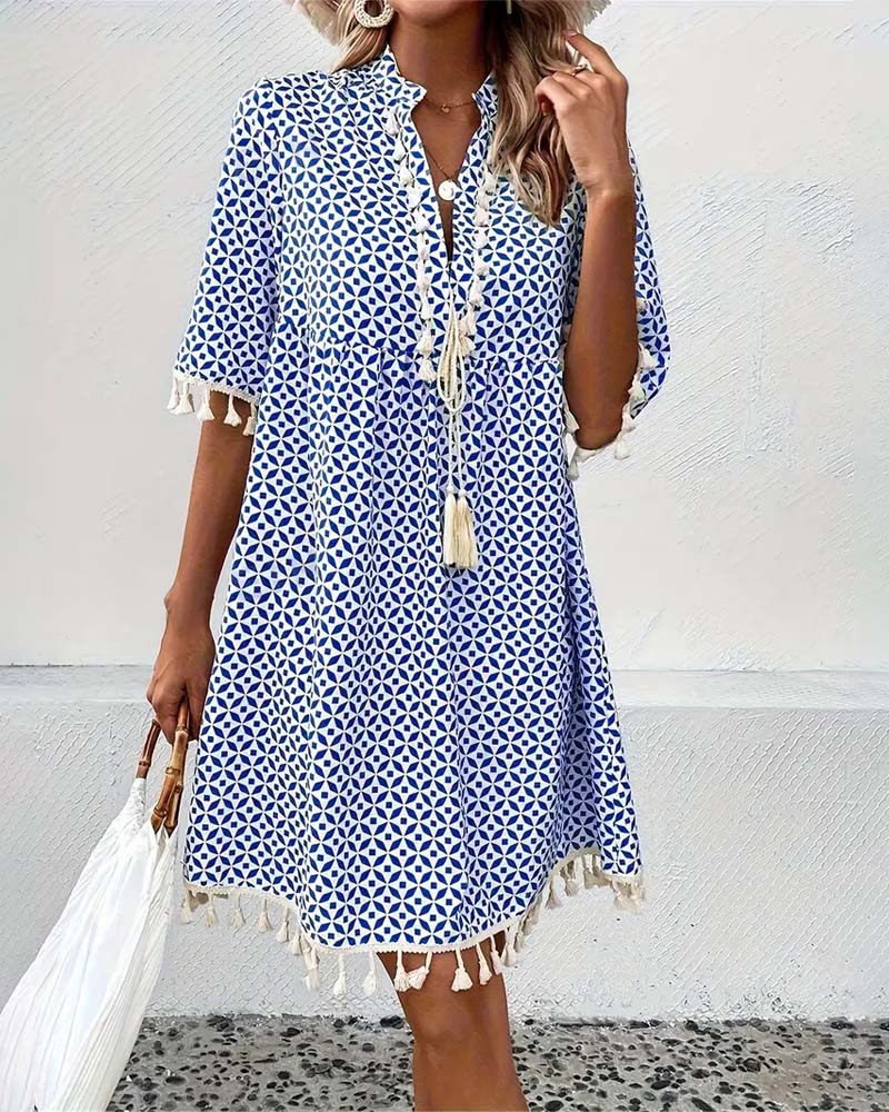 Abito mini fluido azzurro a pois da donna con nappe, perfetto per un look vacanziero leggero e chic.