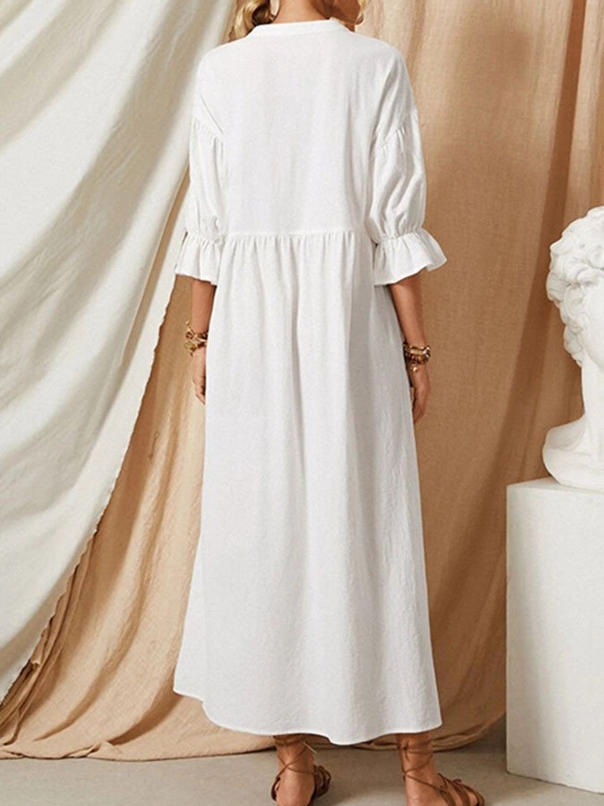 Elegante abito maxi da donna con maniche a palloncino e dettagli abbottonati, ideale per moda estiva casual chic.