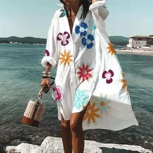 Abito estivo midi fluido da donna, con taglio chemisier, per un look leggero e raffinato. Ideale per giornate calde.