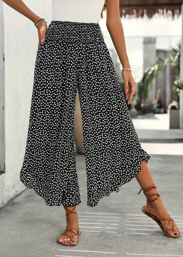 Pantaloni donna a gamba larga a pois vita alta, ideali per primavera estate. Comodi e alla moda.