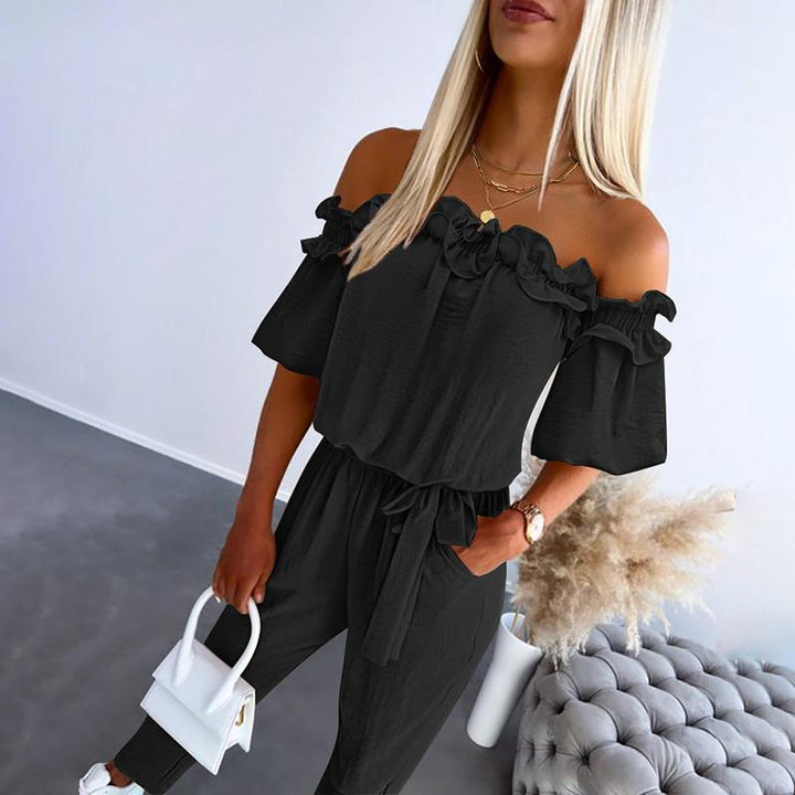 Jumpsuit donna elegante monospalla, con raffinati volant e cintura. Stile casual chic per primavera estate.