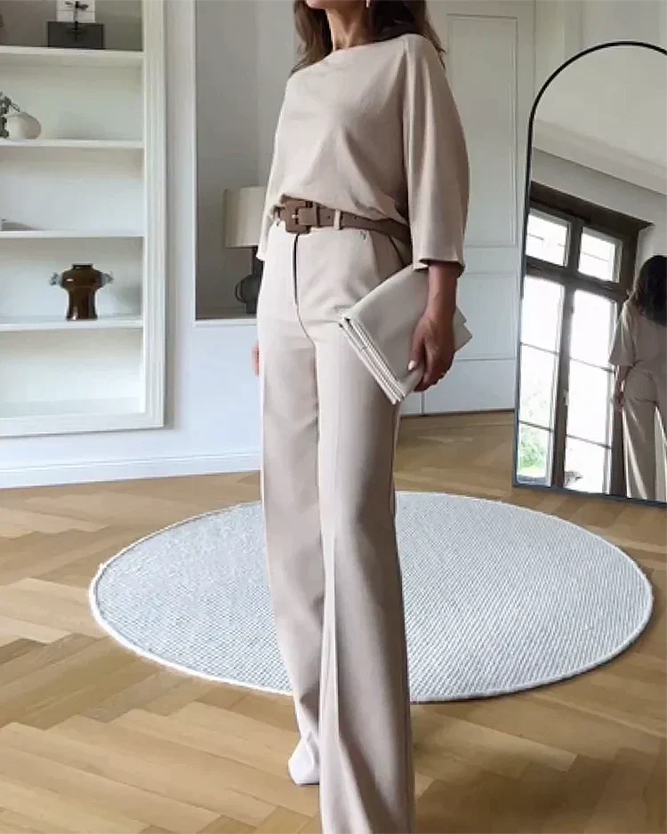 Completo donna elegante due pezzi con top a pipistrello e pantaloni larghi. Perfetto per outfit casual chic.