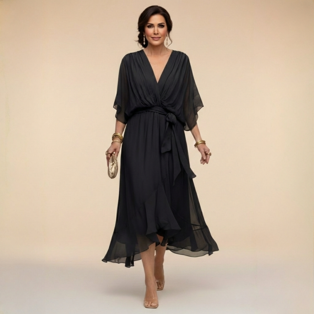 Vestito midi fluido da donna, scollo a V e cintura in vita. Perfetto per serate eleganti e occasioni speciali.
