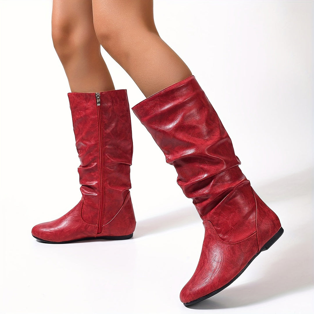 Stivali moda al ginocchio da donna con tacco basso e zip laterale. Essenziali per il tuo guardaroba.