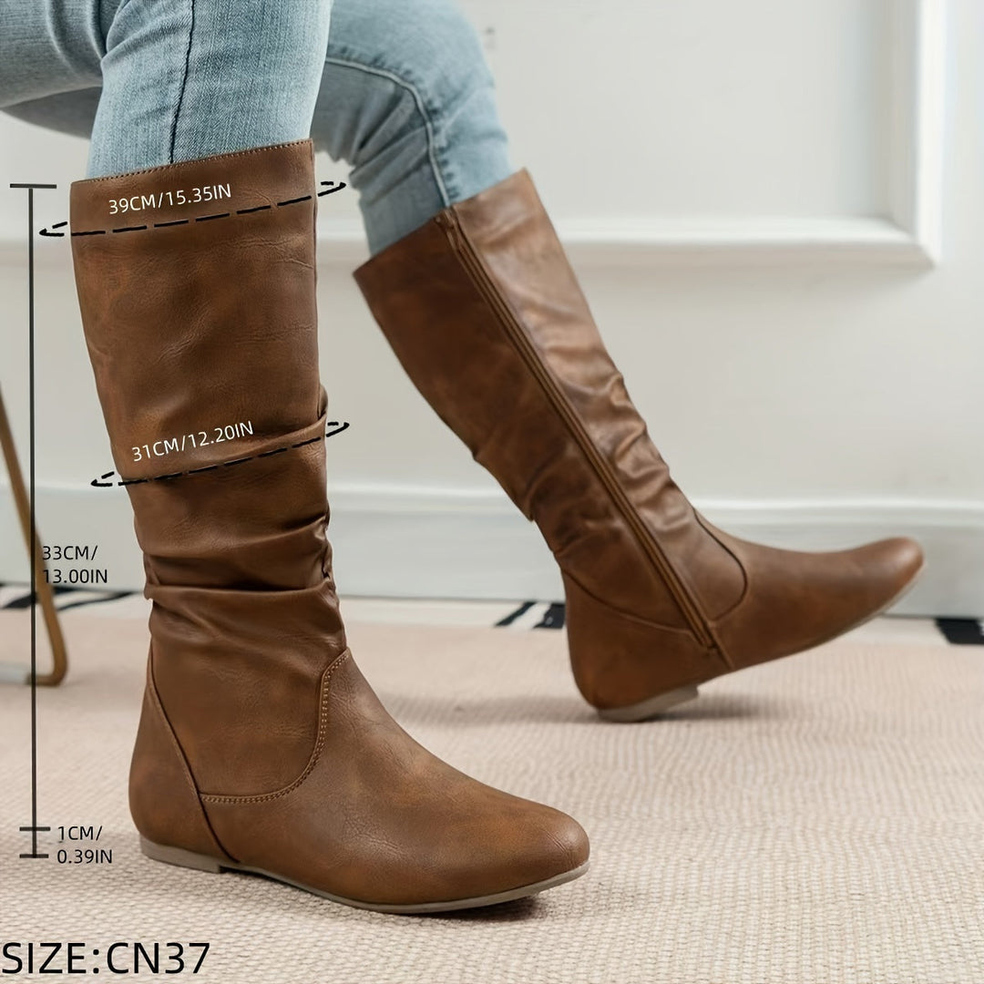 Stivali eleganti al ginocchio da donna, tacco basso, zip. Perfetti per serate o outfit raffinati.