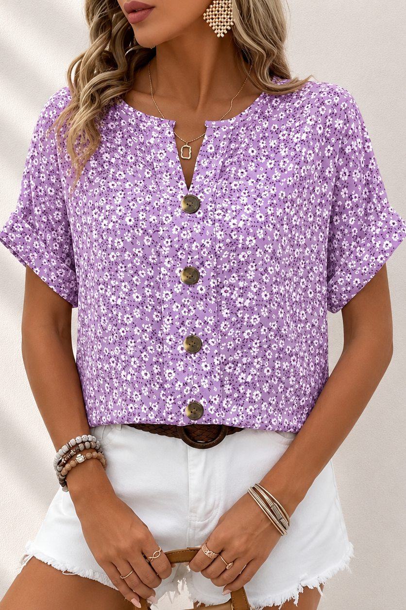 Elegante blusa floreale da donna con bottoni, ideale per look casual chic. Blusa estiva con maniche corte, perfetta per moda donna.