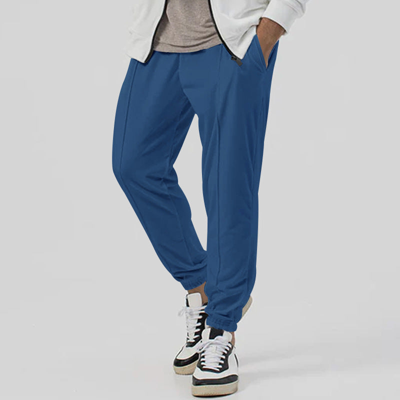 Tuta uomo con vita media, design tapered per uno stile streetwear moderno e rilassato.
