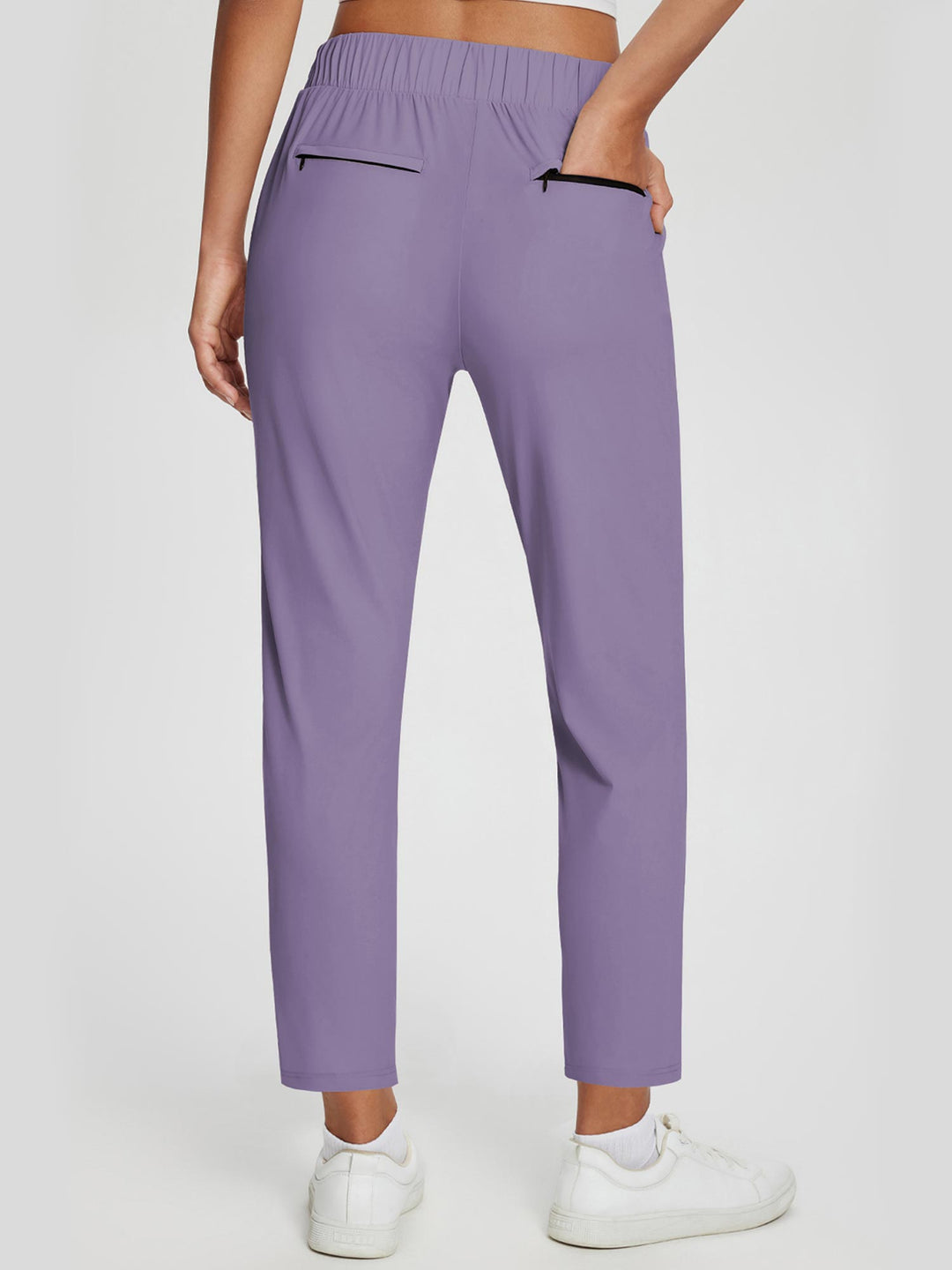 Pantaloni donna casual/sportivi, vita alta, UPF 50+, spacco e tasche. Per comfort quotidiano.