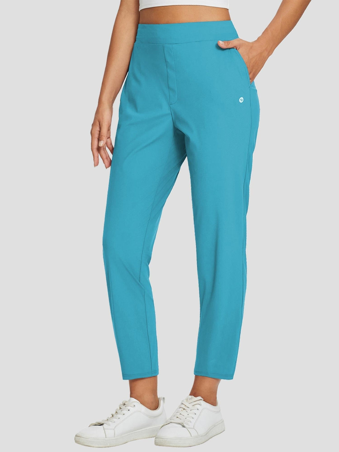 Pantaloni sportivi donna in colore neutro, vita alta, UPF 50+, spacco e tasche. Per hiking.