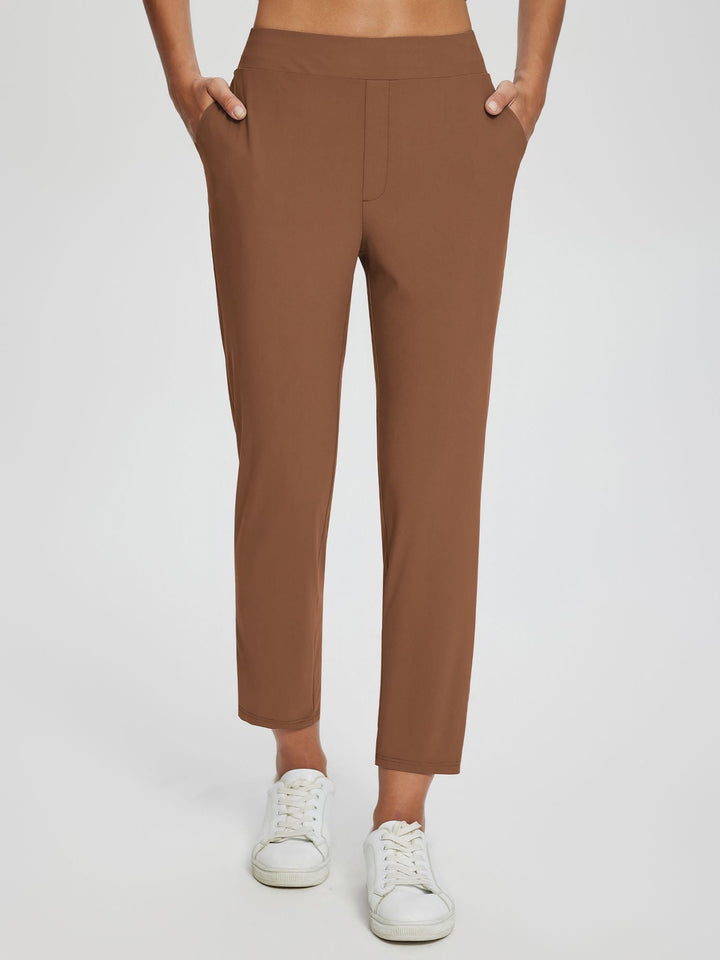 Pantaloni sportivi donna vita alta UPF 50+, spacco laterale alla moda, tasche pratiche.