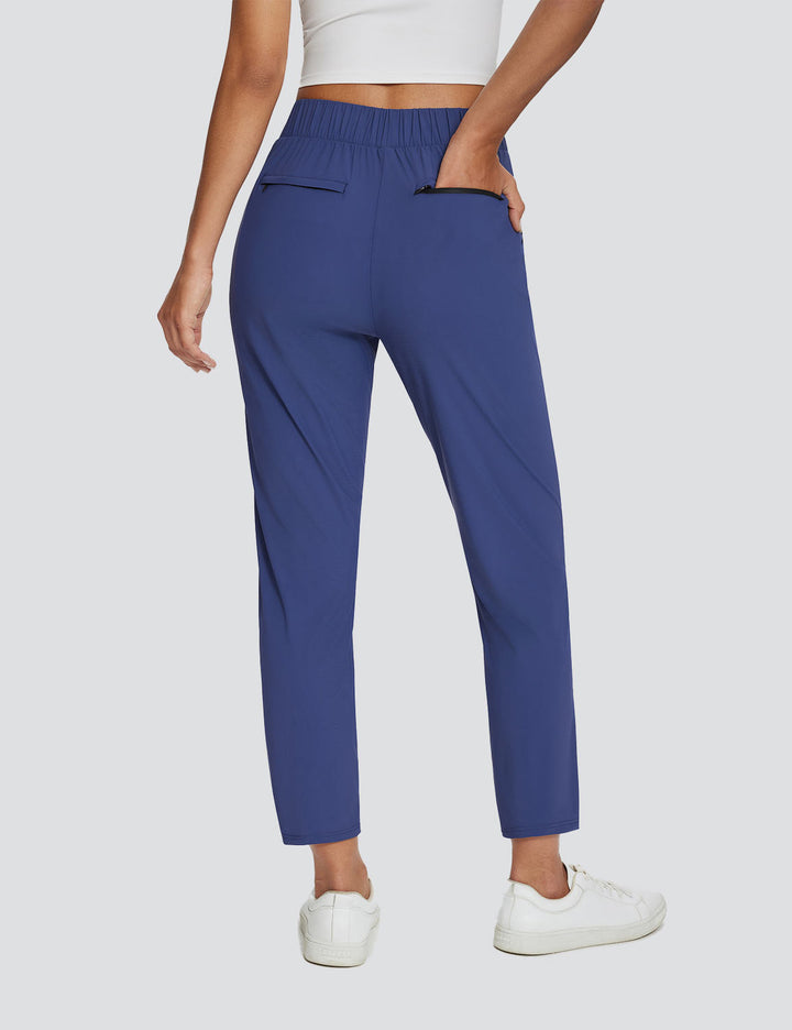 Pantaloni sportivi donna con vita alta, tasche multiple, UPF 50+, ideali per hiking e viaggio.