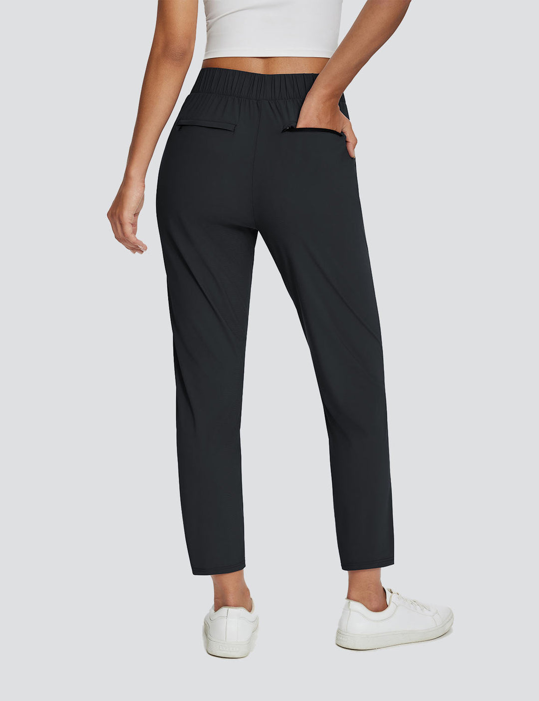 Pantaloni donna UPF 50+, spacco alla caviglia, vita alta, tasche laterali, perfetti per sport.