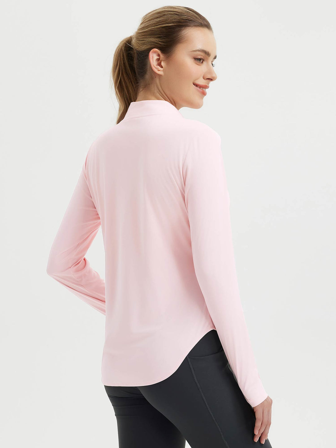 Abbigliamento fitness donna: maglia maniche lunghe, fori pollici, orlo arrotondato, mezza zip.