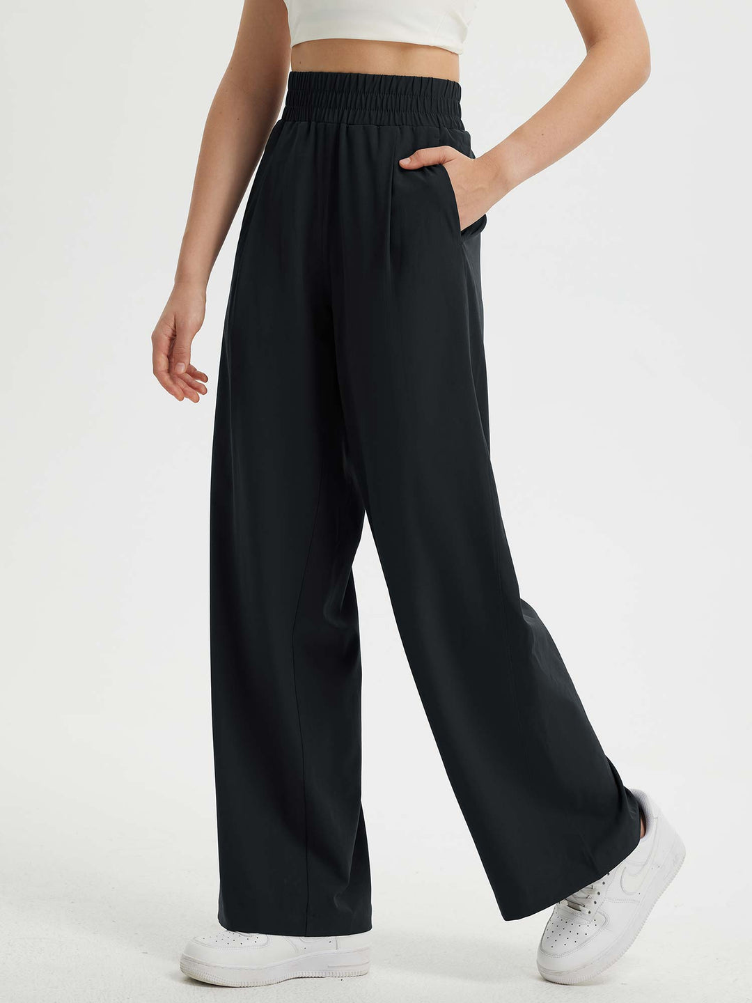 Pantaloni eleganti da donna a gamba larga, vita elastica e tasche. Comfort e stile in un unico capo.