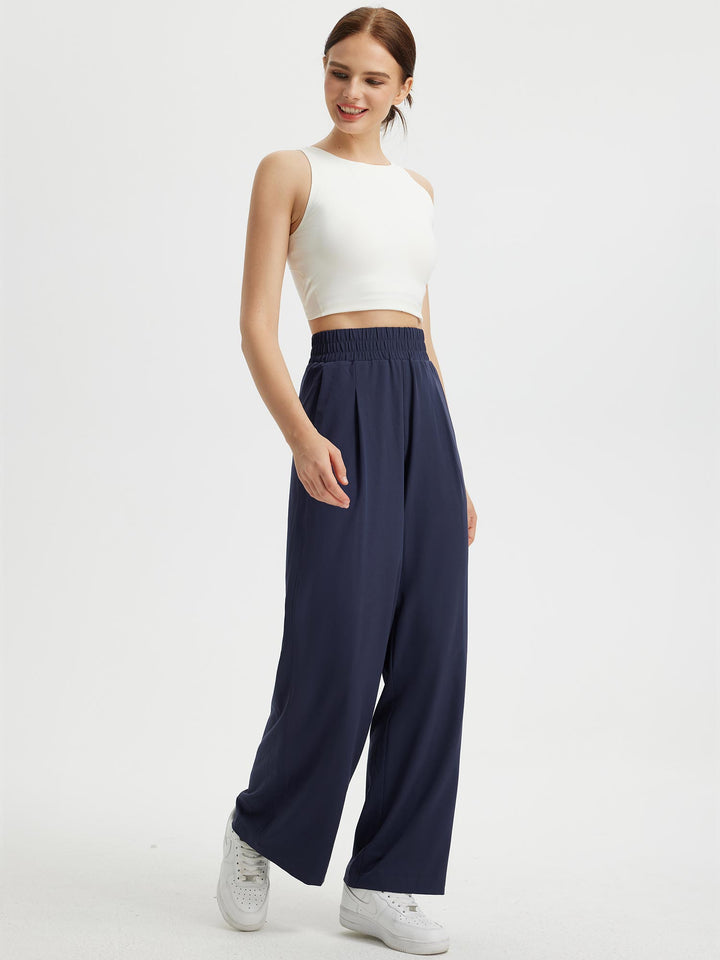 Pantaloni donna fluidi con gamba ampia. Vita elastica, tasche. Stile versatile, perfetti anche per l'estate.