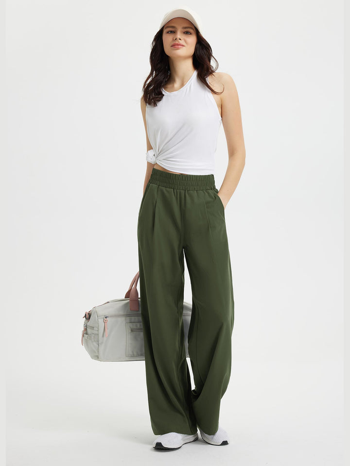 Pantaloni femminili ampi, vita elastica regolabile e tasche. Versatili per look casual chic, massimo comfort.
