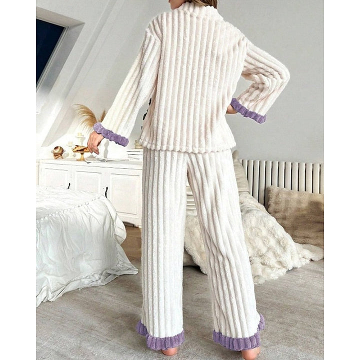 Set due pezzi donna bianco a coste, top con volant e pantaloni elasticizzati, ideale per il giorno.