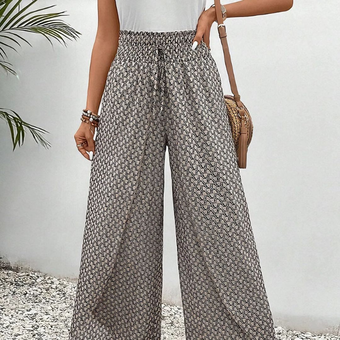 Pantaloni larghi donna grigio chiaro, vita alta e gamba comoda. Perfetti per un look casual e rilassato.