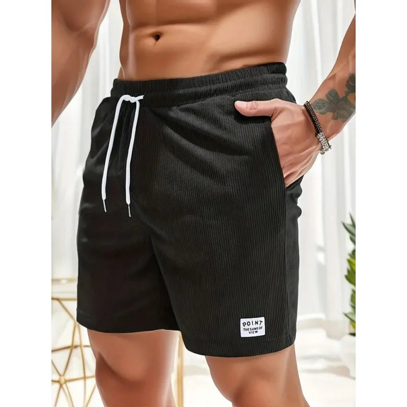 Pantaloncini uomo leggeri grigi con coulisse regolabile, perfetti per l'estate e il tempo libero. Moda estiva.