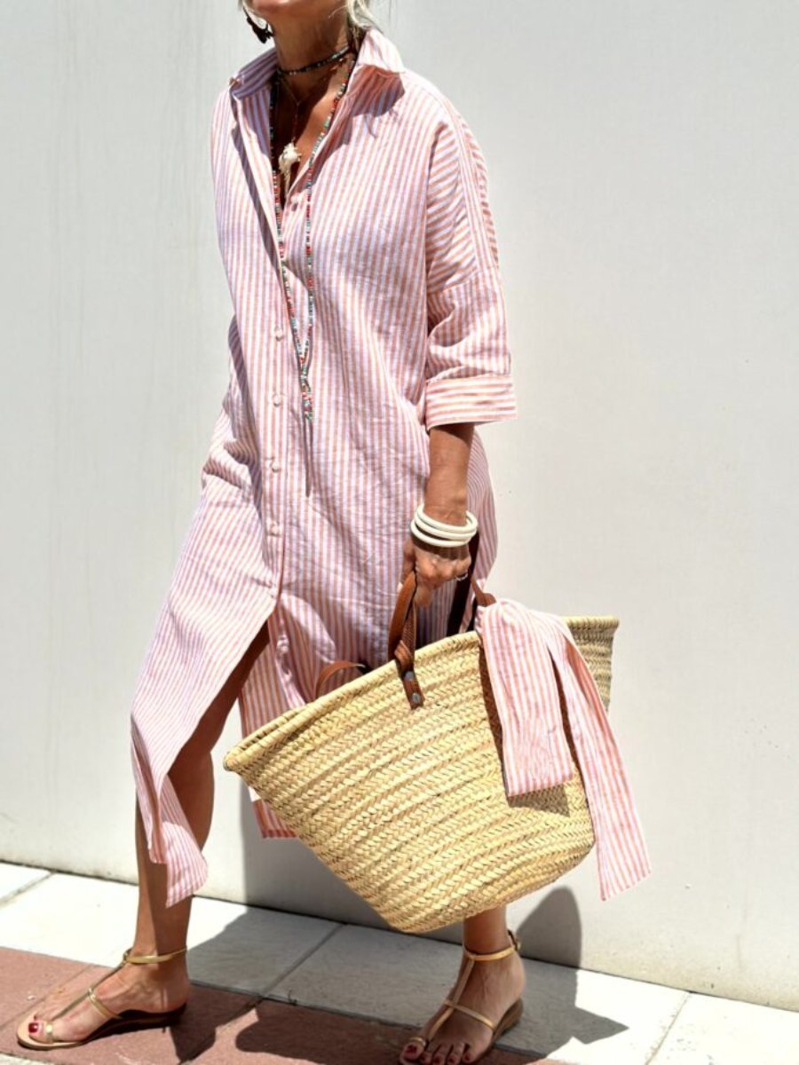 Elegante camicia donna a righe, perfetta per un look casual chic in ufficio o abbigliamento classico versatile.