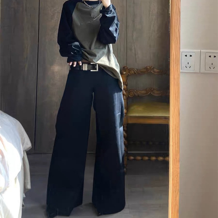Pantaloni donna a gamba larga neri, vita bassa, taglio allungato per un look elegante e di moda.