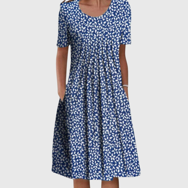 Abito midi da donna floreale con taglio svasato, comodo ed elegante per eventi diurni e serali.
