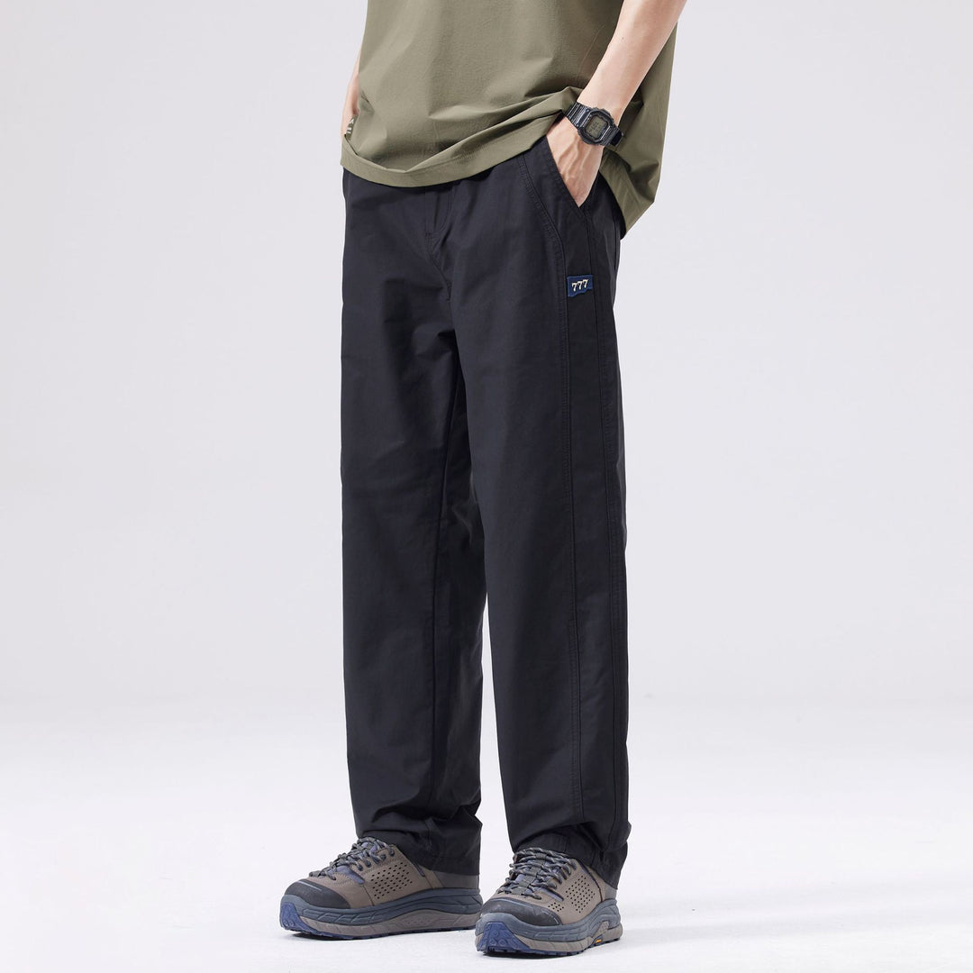 Pantaloni casual uomo neri a gamba dritta e vita media, ideali per comfort e stile streetwear versatile.