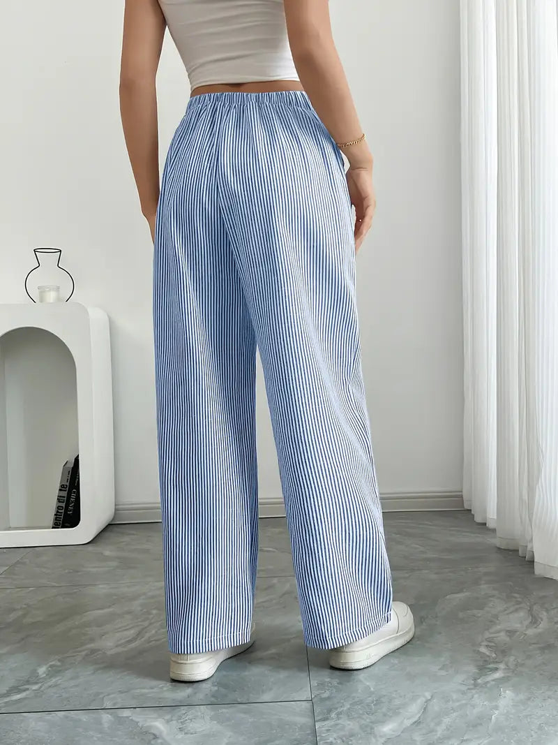 Pantaloni donna a vita alta con righe, larghi e fluidi, per un tocco di classe estivo.