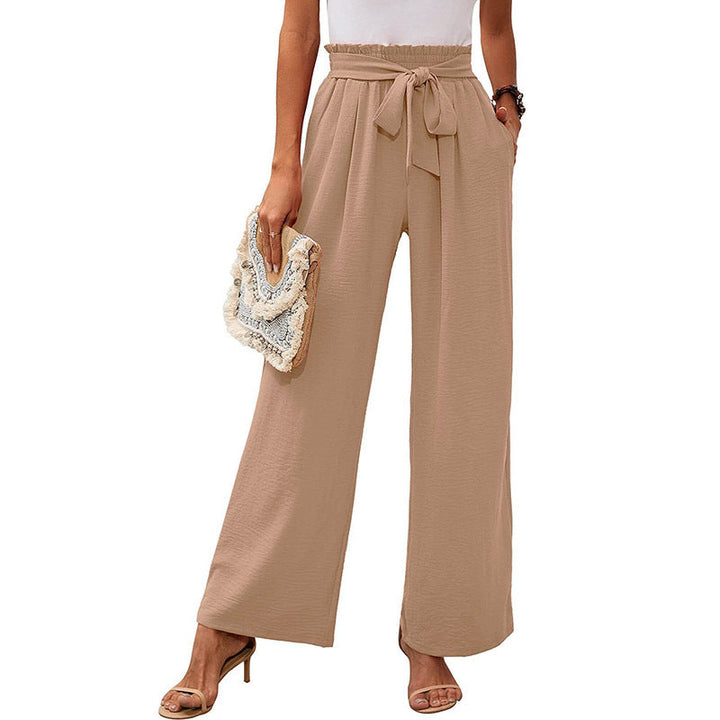 Pantaloni estivi donna: vita alta, gamba ampia, nodo decorativo. Look trendy e confortevole.