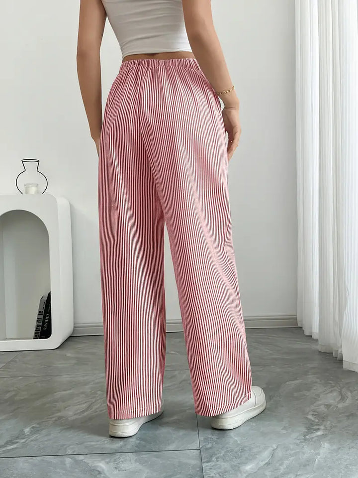 Pantaloni estivi donna a righe, vita alta, ideali per outfit versatili e freschi.