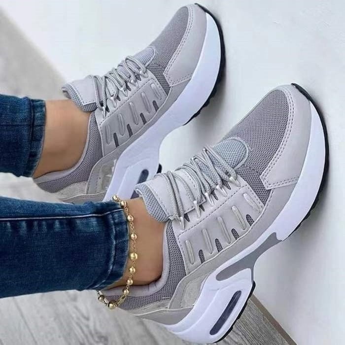 Sneakers donna con supporto plantare, suola ammortizzata, ideali per passeggiate confortevoli e attive.
