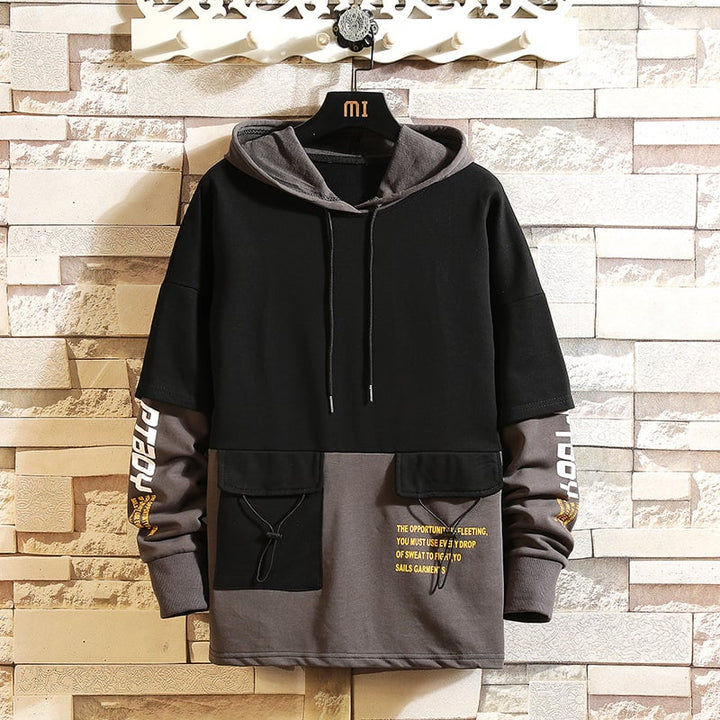 Maglione uomo casual con cappuccio e blocchi di colore, perfetto per l'autunno e lo stile moderno.