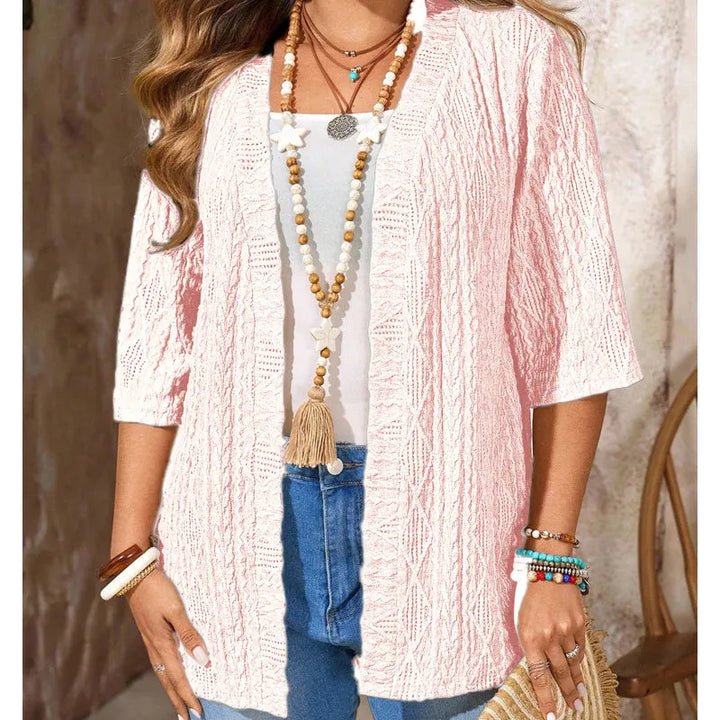 Moda donna: cardigan traforato leggero con maniche 3/4, perfetto per outfit eleganti.