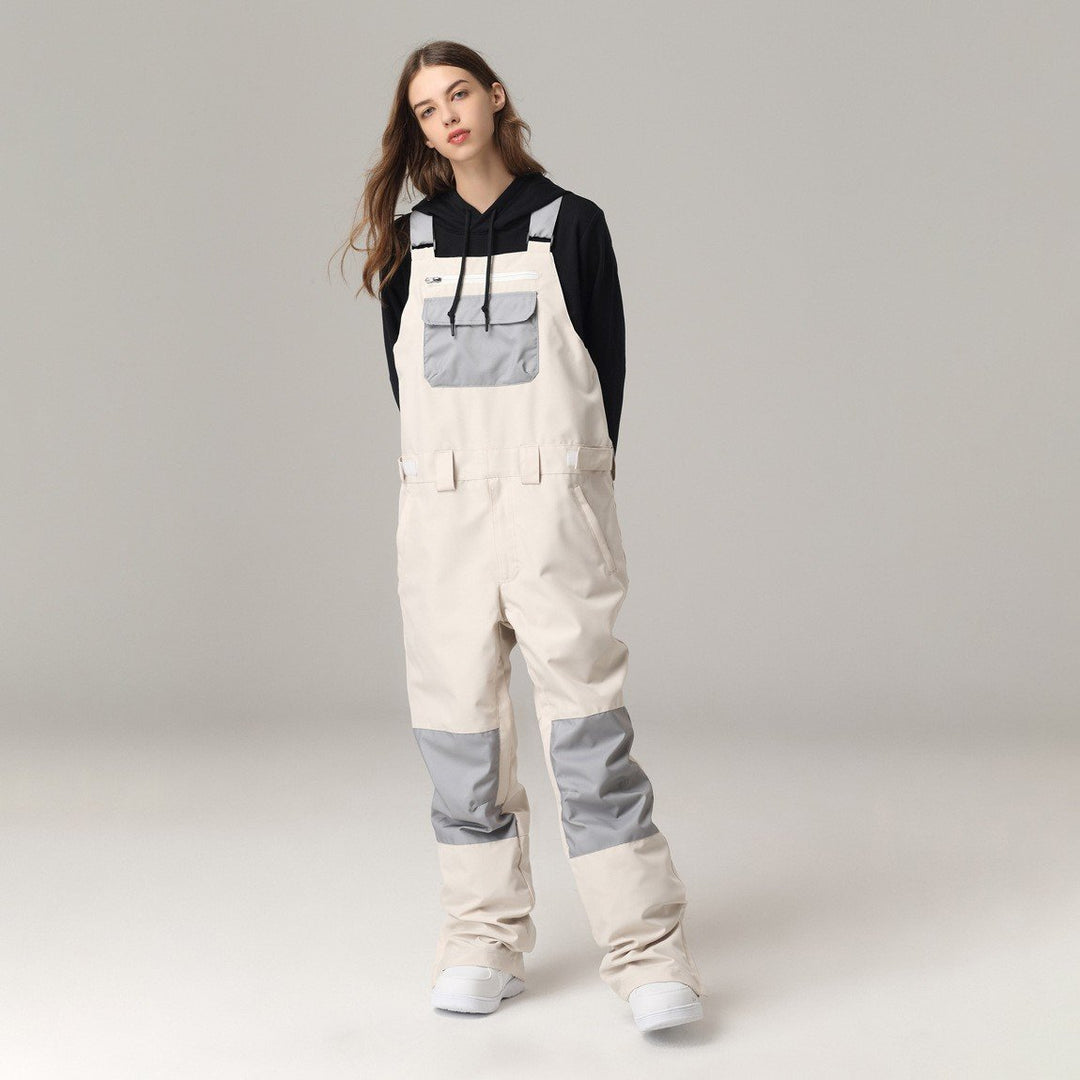 Salopette sci unisex con bretelle regolabili, comfort e protezione impermeabile per sport invernali.