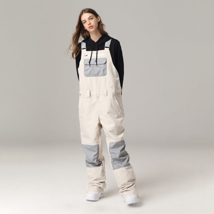 Salopette sci unisex con bretelle regolabili, comfort e protezione impermeabile per sport invernali.