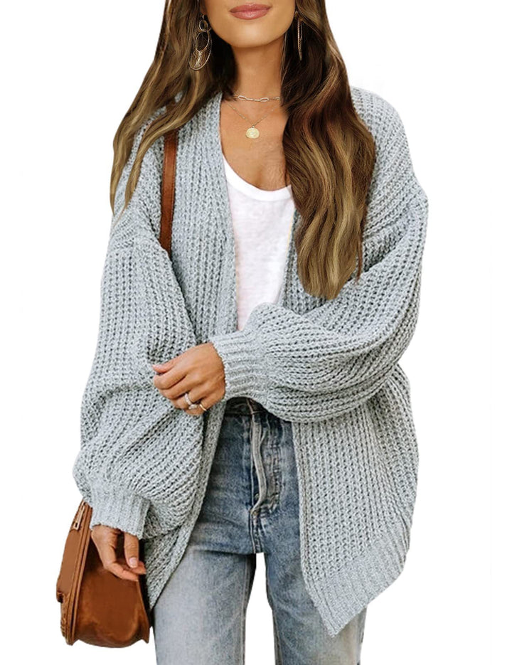Cardigan donna oversize moderno con maniche a lanterna. Caldo, avvolgente, per uno stile contemporaneo.