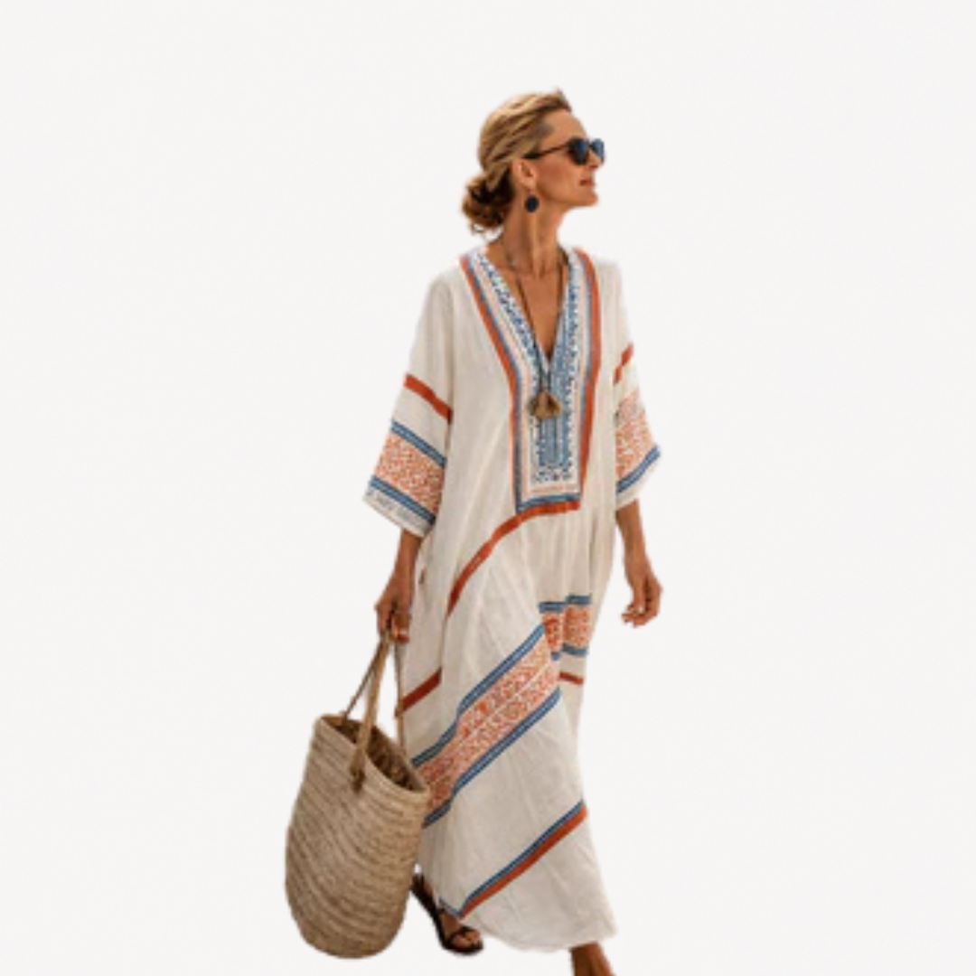 Caftano donna lungo a righe, fluido ed elegante. Ideale come copricostume o vestito spiaggia per la moda estiva.